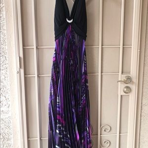 Floor length evening gown with a luxurious satin pleated skirt